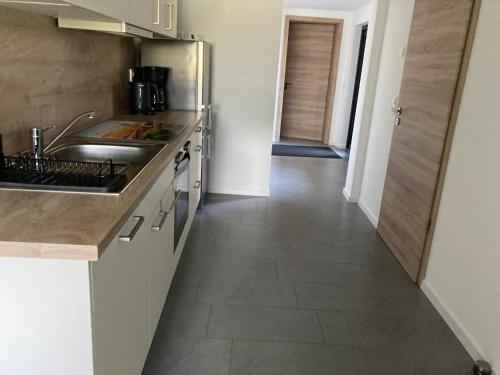 a kitchen with a sink and a counter top at Ferienwohnung Christel in Upahl