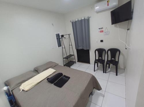 TV a/nebo společenská místnost v ubytování chalés da Ana pertinho do rio preguiça