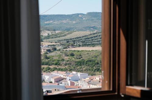 a view of a town from a window at Il mio tempo al Castello in Castelsardo