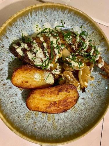 a plate of food with potatoes and vegetables on it at Le Refuge de Castagnols in Vialas