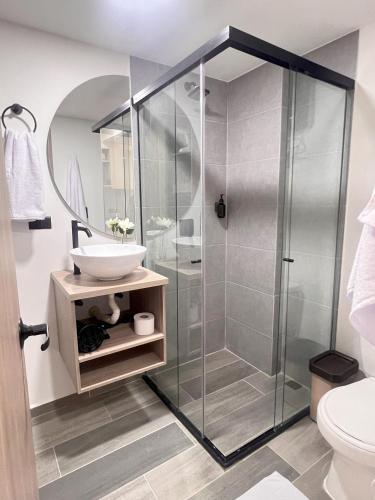a bathroom with a shower and a sink at BIT by Simple stay in Medellín