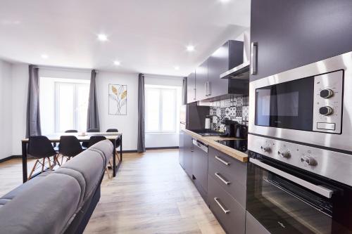 Kuchyň nebo kuchyňský kout v ubytování TH 201 Appartement F3 spacieux 1 à 5 personnes au 2ème étage