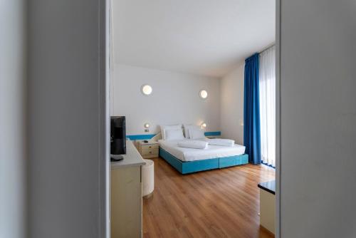 Hi Hotels Riva del Gardaにあるベッド