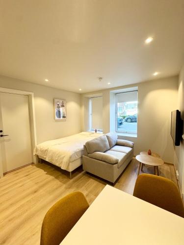 Ένα ή περισσότερα κρεβάτια σε δωμάτιο στο Bright & Cozy Studio - Central Location