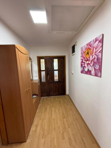a room with a painting of a flower on the wall at Dream house in Laktaši