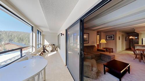 a living room with a view of a living room at Beautiful 2 BR Condo with Mountain View! in Mammoth Lakes