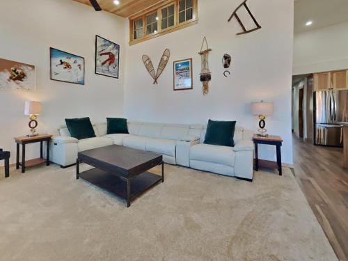 a living room with a couch and a table at Spacious 3 BR Condo with Loft in Mammoth Lakes