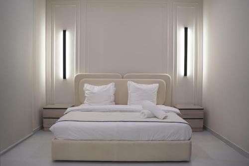 Ένα ή περισσότερα κρεβάτια σε δωμάτιο στο Rateel Apartments 2