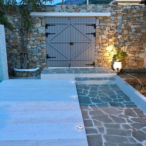a driveway with a gate and a stone wall at Exquisite Thassos Villa Villa Mare 4 Bedroom Private Pool Sea View Skala Prinos in Prinos