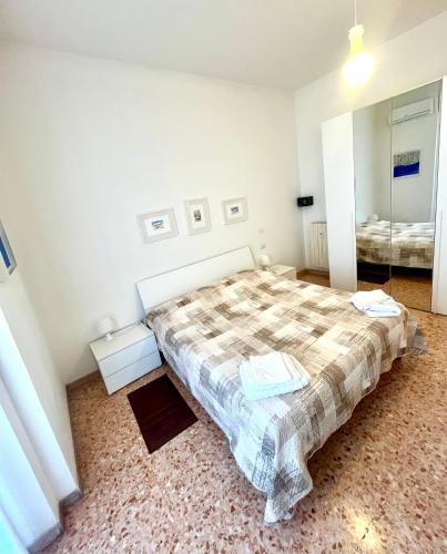 a bedroom with a bed and a mirror at Alloggio Primavera in Terni