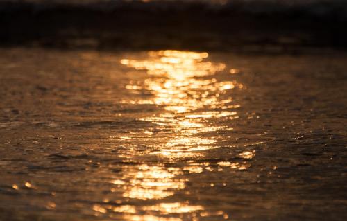 an image of the sun reflecting on the water at Couples Condo B42 1BR Pool Jacuzzis Covered Terrace Walk to Ocean and Dining Secure Complex in Jacó