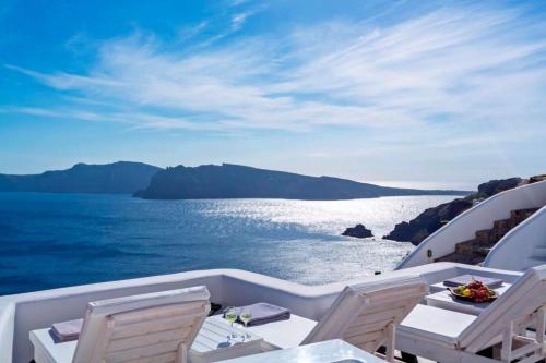 a view of the ocean from a boat at Luxury Santorini Villa Full Moon Villa 1 Bedrooms Outdoor Plunge Pool Sea & Caldera View Oia in Thólos