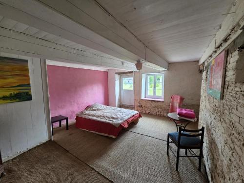 Katil atau katil-katil dalam bilik di Château de Beaumanoir