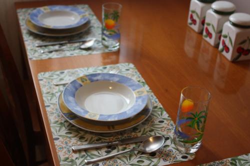 a table with a plate and a glass on a table at Bridge To Venice in Venice