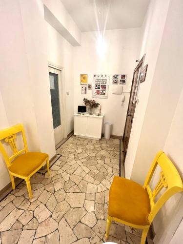a room with two chairs and a table at Alloggio Primavera in Terni