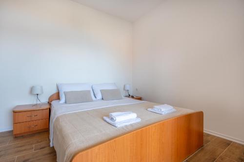 a bedroom with a bed with two towels on it at Gabriel in Neum