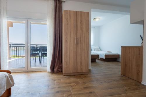 a room with a bedroom with a bed and a window at Gabriel in Neum