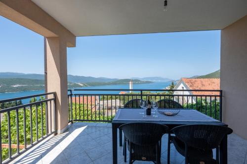 a patio with a table and chairs on a balcony at Gabriel in Neum
