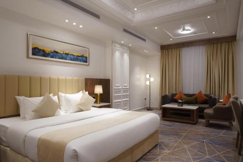 Postel nebo postele na pokoji v ubytování Nars Plus Al Naeem Hotel