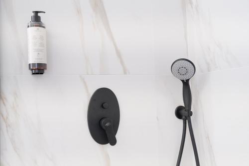 a hair dryer and a blow dryer on a wall at Luxury l'Aurora Room in Castelsardo