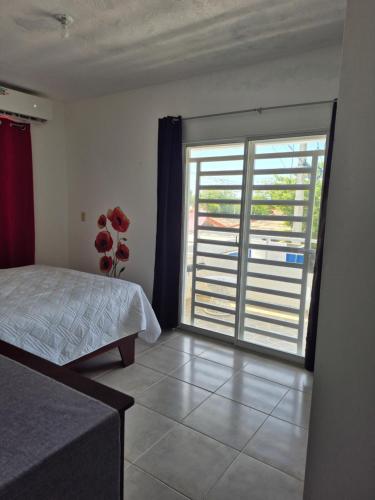 Ένα ή περισσότερα κρεβάτια σε δωμάτιο στο OMY Apartments Nagua 2A