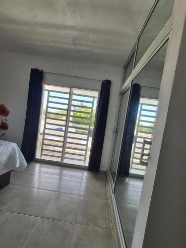 Ένα ή περισσότερα κρεβάτια σε δωμάτιο στο OMY Apartments Nagua 2A