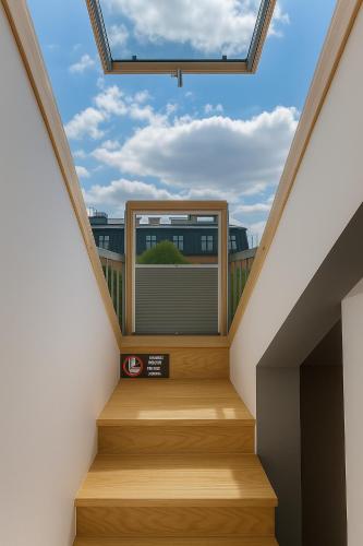 a stairwell with a skylight in a house at MedHotel Smart Krupnicza w Krakowie in Kraków