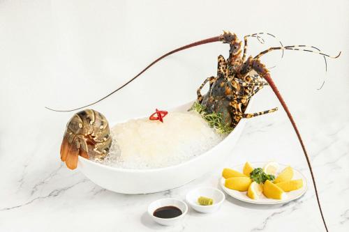 a crab in a bowl of ice with fruit at JW Marriott Hotel Hanoi in Hanoi
