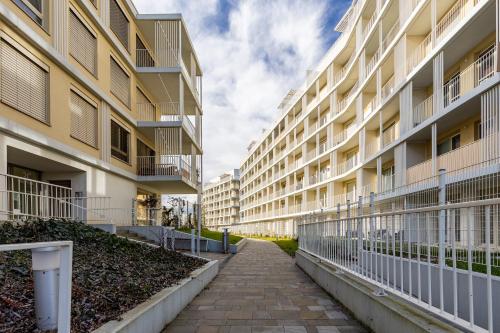 an empty alley between two apartment buildings at Terrace&RelaxStudio free parking in Bratislava