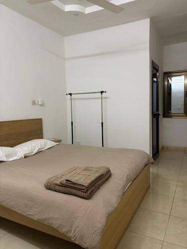 En eller flere senge i et værelse på Villa Kaya