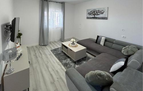 a living room with a couch and a table at Gorgeous Apartment In Kastel Stari in Kastel Stari