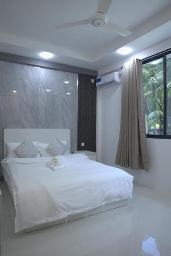 Una cama o camas en una habitación de Moro SW Laamu