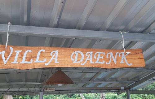 a sign that says vila dagyss hanging from a ceiling at Villa Daenk Bogor in Cinagara