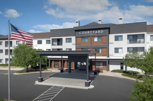 a building with an american flag in front of it at Courtyard by Marriott Colorado Springs South in Colorado Springs