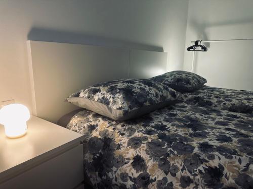 a bedroom with a bed with two pillows on it at House Burić in Otočac
