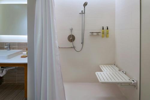 a bathroom with a shower and a sink at Element Albuquerque Uptown in Albuquerque