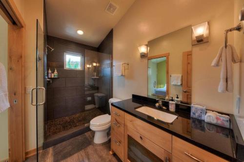 a bathroom with a sink and a toilet and a shower at Stylish Casita Moab 2 - In Town, Outdoor Sauna in Moab