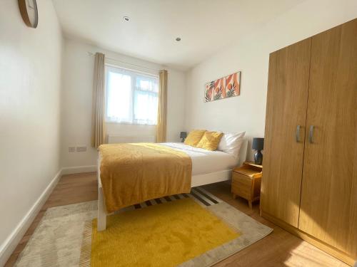 a bedroom with a bed and a window at beautifull house with 6 double bedrooms in London