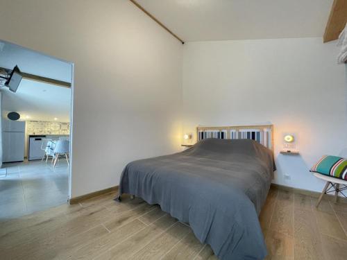 a bedroom with a bed and a dining room at Selaurua in Sare
