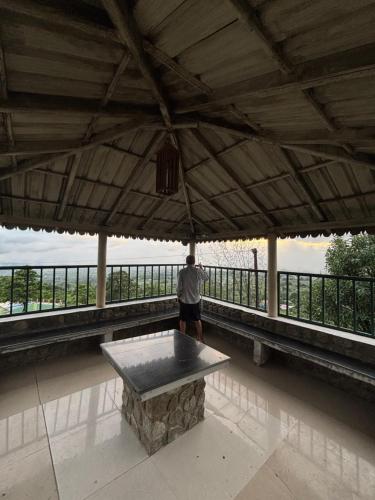 a man taking a picture of a table in a building at Squirrel snuggle2 in Kota Bāgh