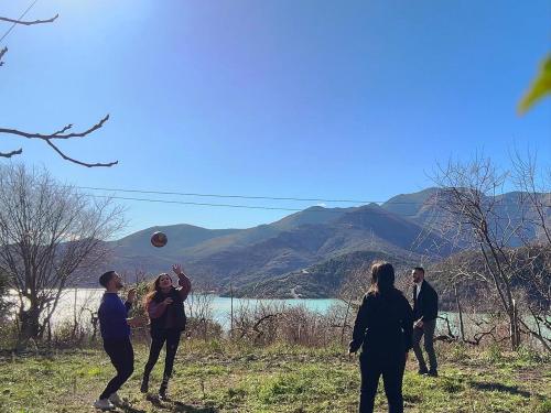 a group of people playing with a ball in a field at Mark Toma Guesthouse 
