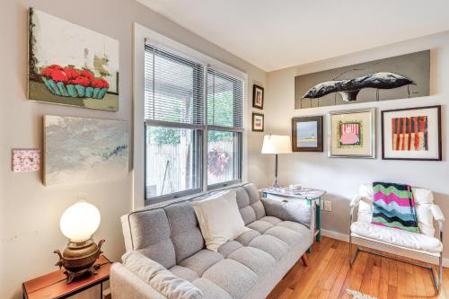 a living room with a couch and a window at Cape Cod Condo on the National Seashore Bike Path! in Provincetown
