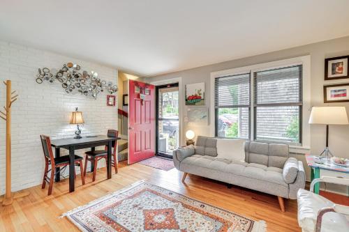 a living room with a couch and a table at Cape Cod Condo on the National Seashore Bike Path! in Provincetown