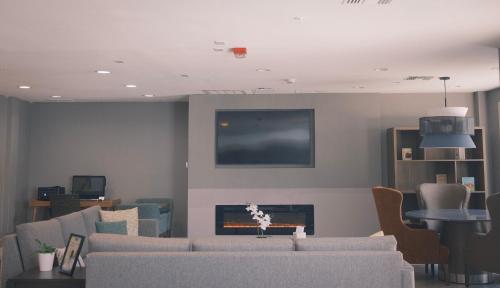 a living room with a couch and a fire place at Staybridge Suites Austin Airport by IHG in Austin