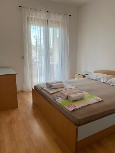 Posteľ alebo postele v izbe v ubytovaní Apartments Dada