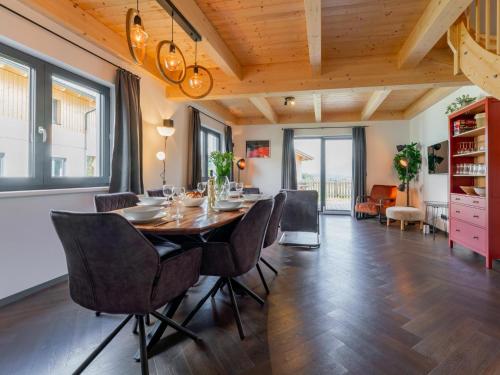 a dining room with a table and chairs at Obermöschach 10B in Obermöschach
