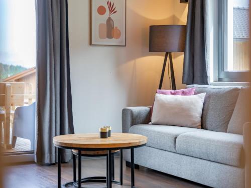 a living room with a couch and a table at Obermöschach 6A in Obermöschach