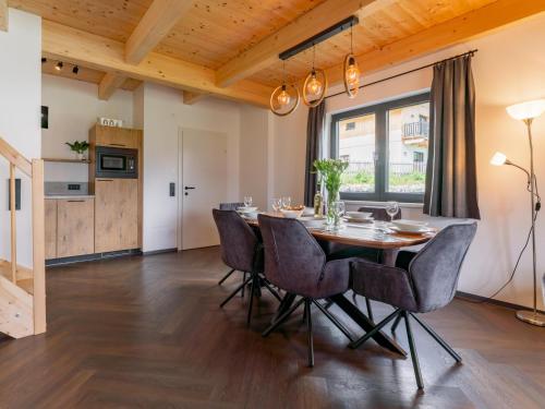 a dining room with a table and chairs at Obermöschach 10 in Obermöschach