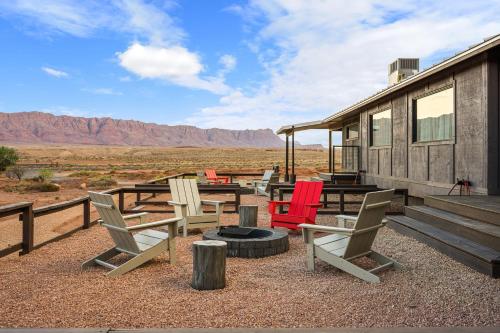 a group of chairs sitting outside of a house at Marble Canyon Lodge in Marble Canyon