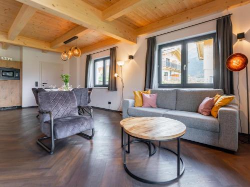 a living room with a couch and a table at Obermöschach 10 in Obermöschach